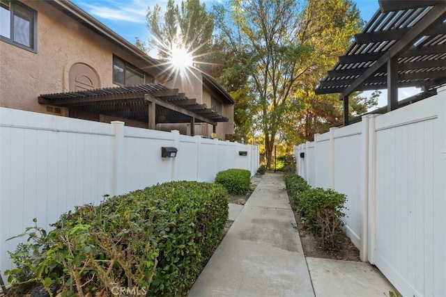 view of side of home with a pergola