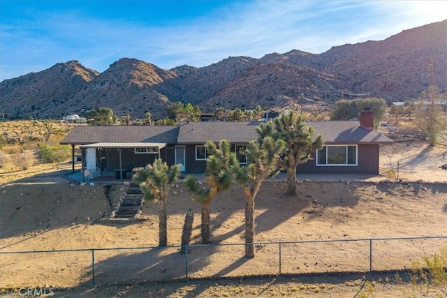 single story home featuring a mountain view