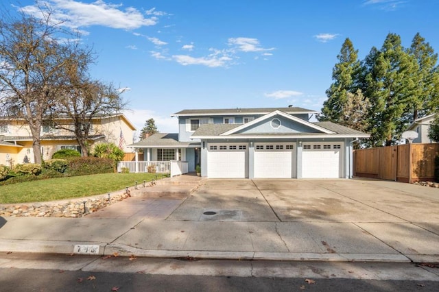 view of front of property featuring a garage and a front yard