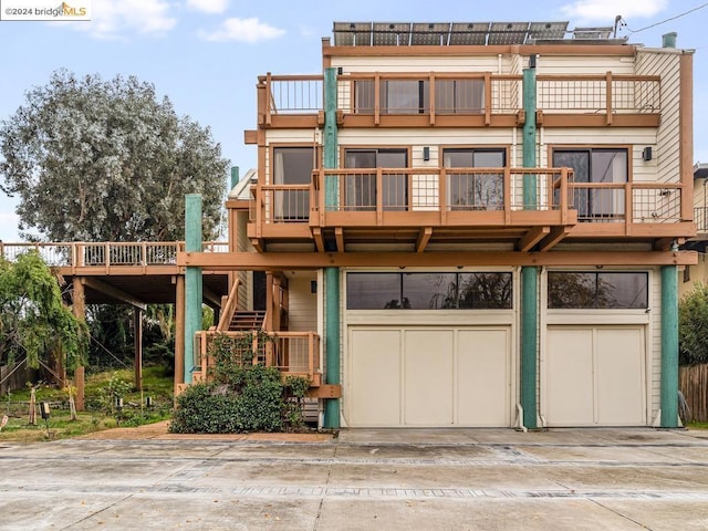 back of house featuring a garage