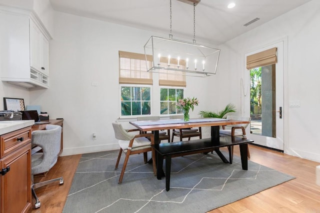 dining room featuring hardwood / wood-style floors and a wealth of natural light