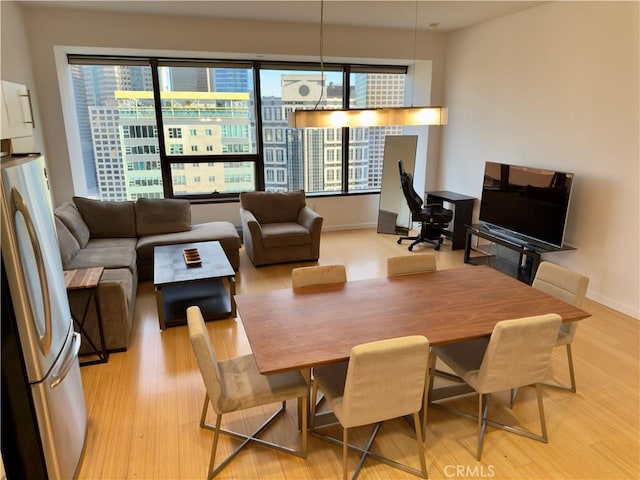 dining area with light wood-type flooring