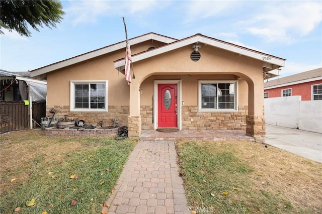 bungalow-style house with a front yard