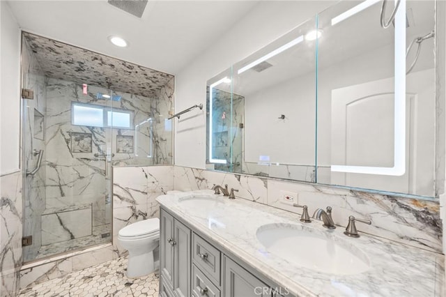 bathroom featuring tile walls, an enclosed shower, vanity, and toilet