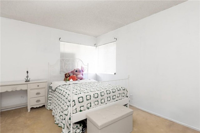 carpeted bedroom with a textured ceiling