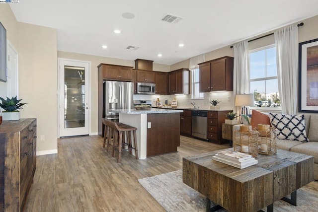 living room with light hardwood / wood-style floors