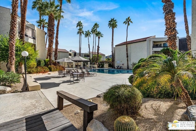 view of swimming pool with a patio area and a gazebo