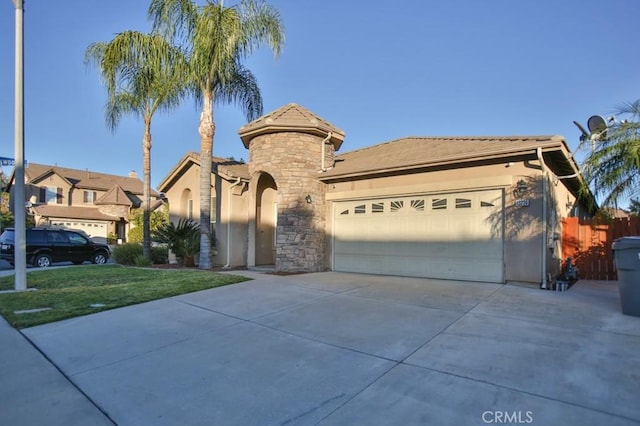 view of front facade with a garage and a front lawn