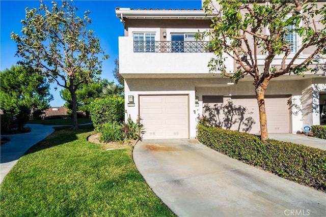 view of front of home with a front lawn, a garage, and a balcony