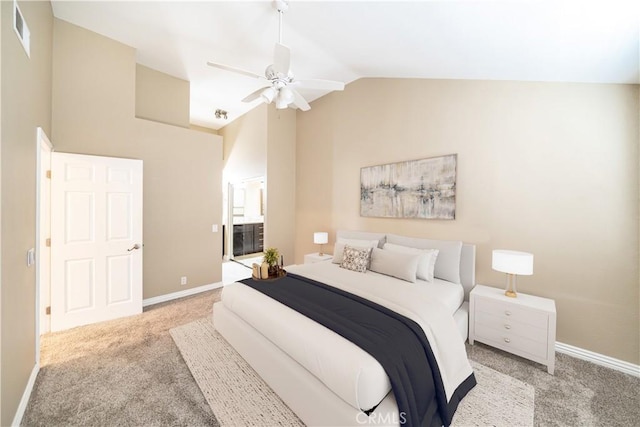 carpeted bedroom featuring ceiling fan and vaulted ceiling