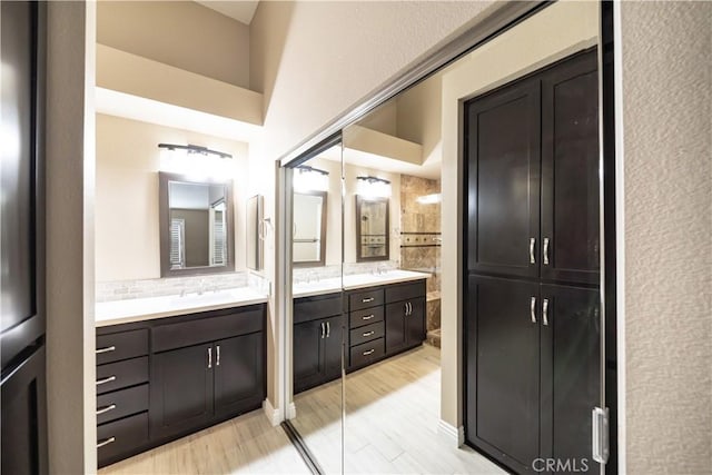 bathroom featuring decorative backsplash and vanity