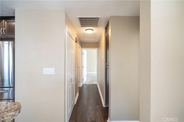 corridor featuring dark wood-type flooring