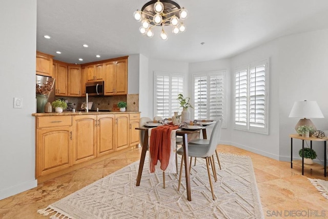 dining room with plenty of natural light and an inviting chandelier