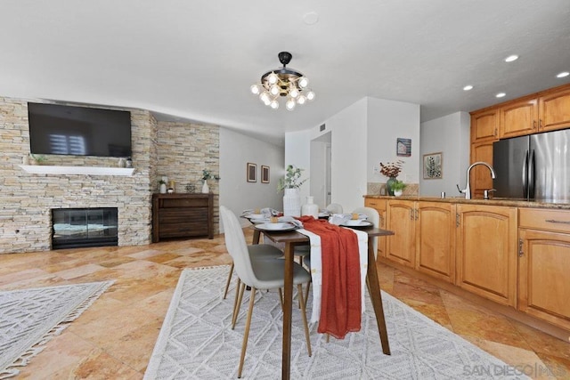 dining space featuring a fireplace