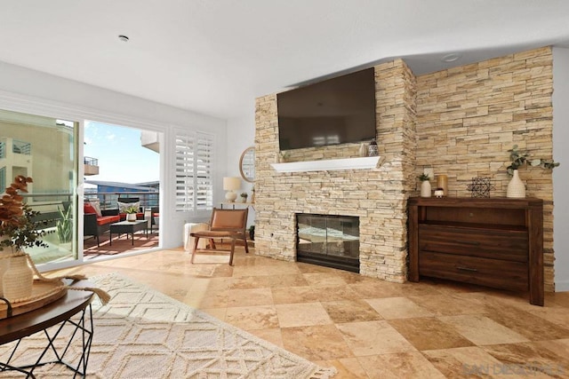 interior space with a stone fireplace