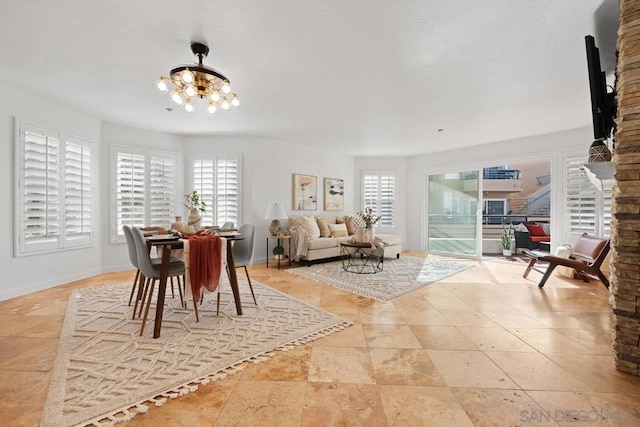 tiled dining area with a notable chandelier