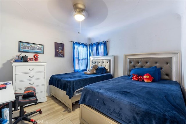 bedroom featuring ceiling fan and light hardwood / wood-style flooring