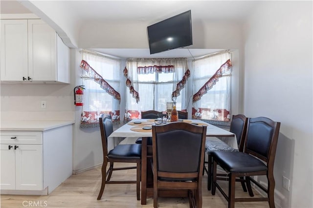 dining area featuring light wood-type flooring