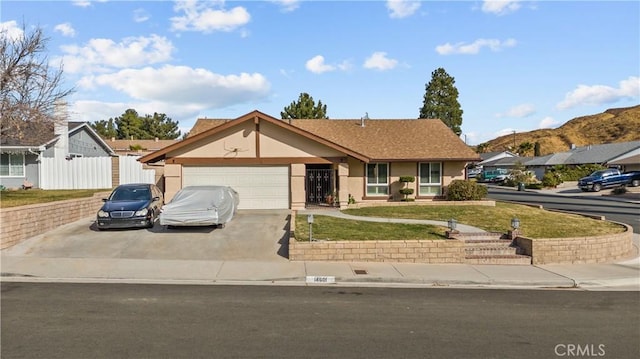 ranch-style home with a front yard and a garage