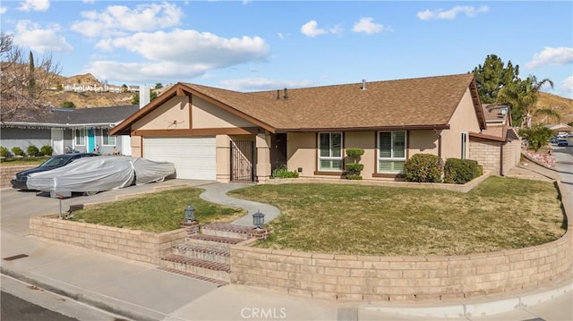 single story home with a front lawn and a garage