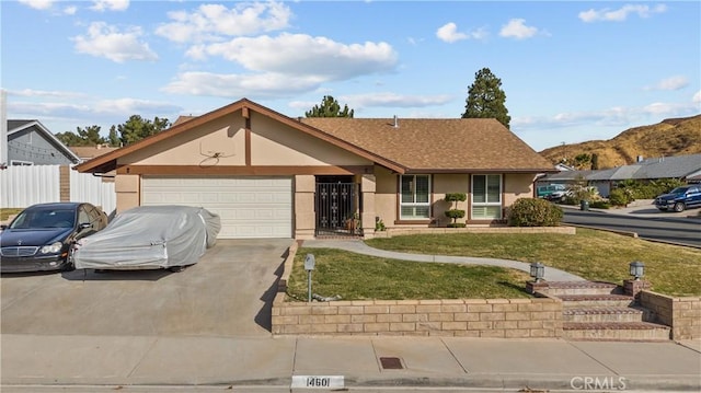 ranch-style home with a front lawn and a garage