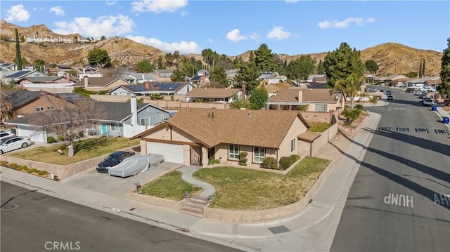 birds eye view of property with a mountain view