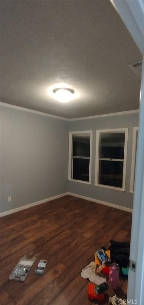 unfurnished room featuring dark hardwood / wood-style floors