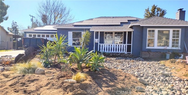 view of front of home featuring solar panels