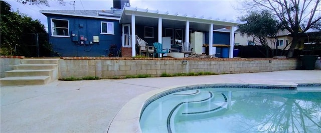 view of pool featuring a patio and central air condition unit