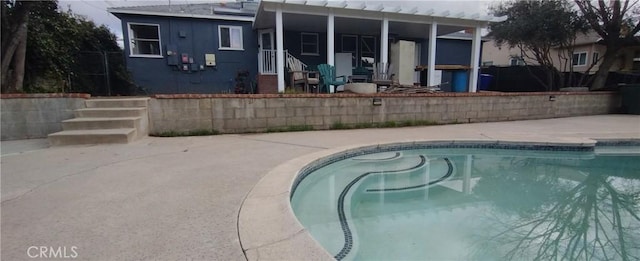 view of swimming pool featuring a patio