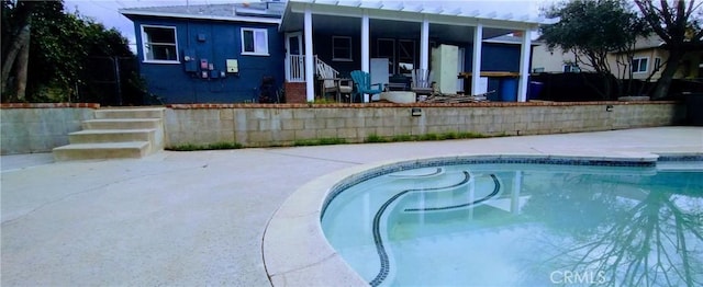 view of pool featuring a patio