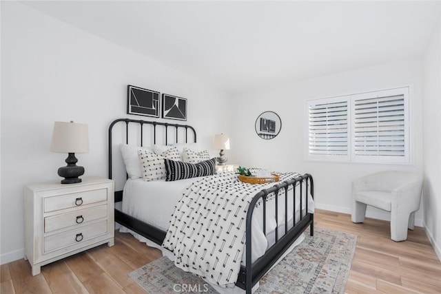 bedroom with light hardwood / wood-style floors