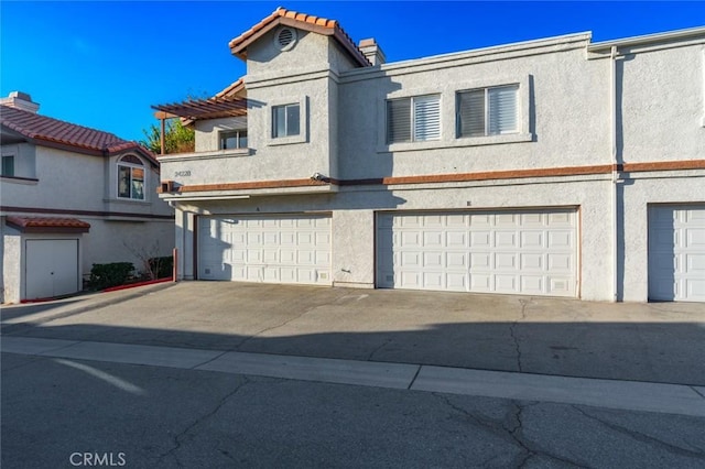 townhome / multi-family property featuring a garage