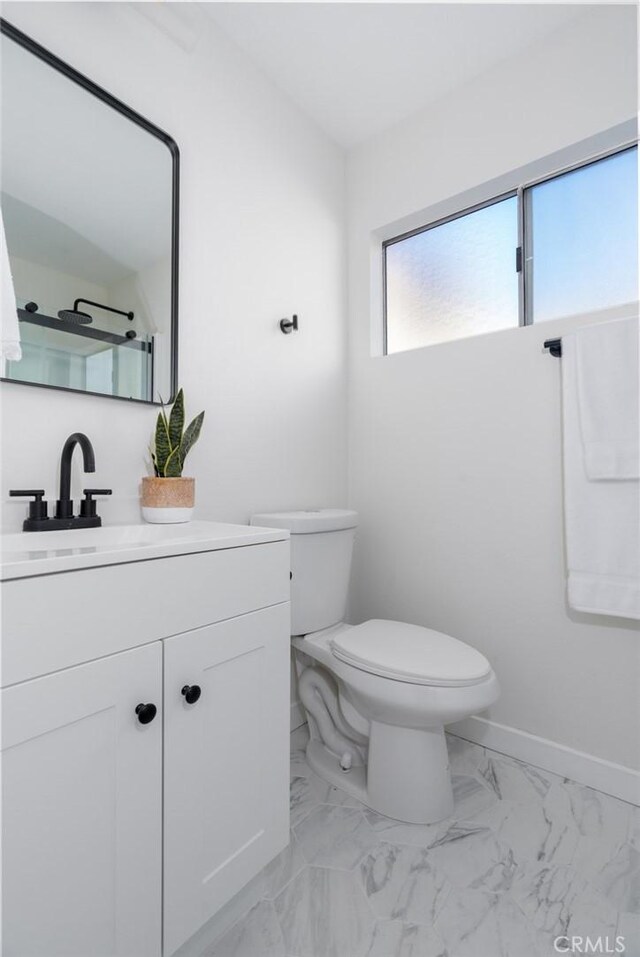 bathroom with toilet and vanity