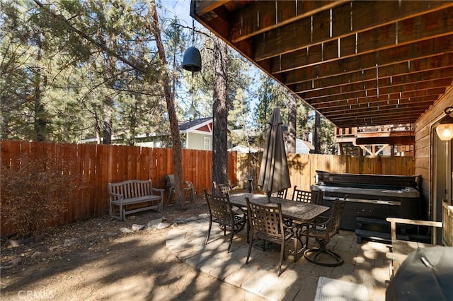 view of patio with a hot tub