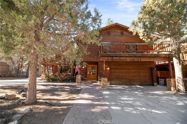 view of front of property featuring a wooden deck and a garage