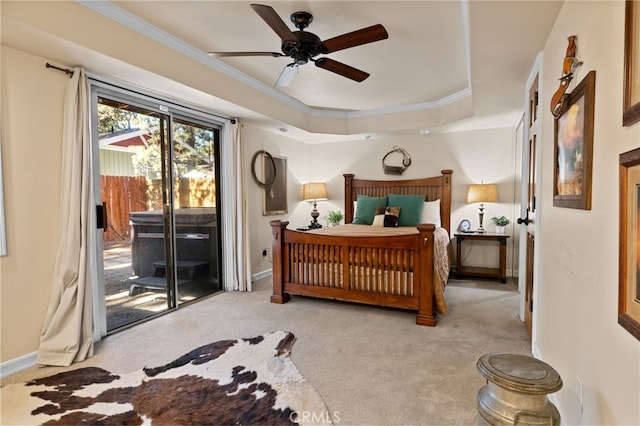 carpeted bedroom featuring ceiling fan, ornamental molding, a raised ceiling, and access to outside