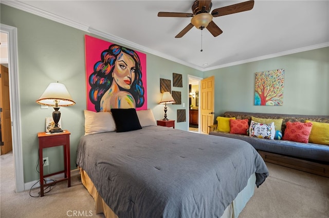 carpeted bedroom with ceiling fan and ornamental molding