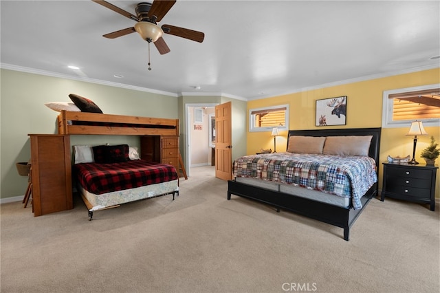 carpeted bedroom featuring ceiling fan and ornamental molding