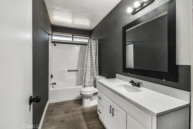 full bathroom with a textured ceiling, toilet, shower / bathtub combination with curtain, and vanity