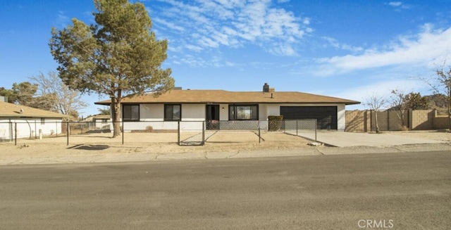 ranch-style house featuring a garage