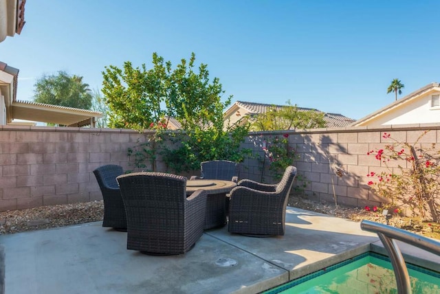 view of patio with an outdoor fire pit