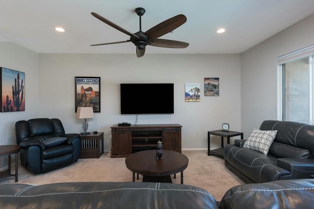 living room with ceiling fan and light colored carpet