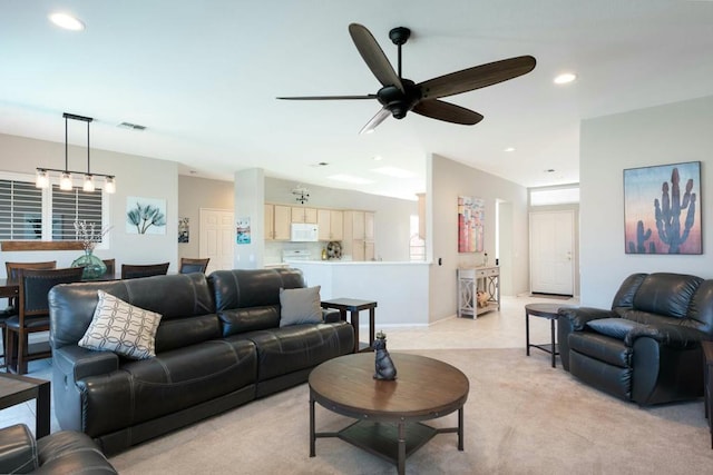 living room with ceiling fan and light carpet