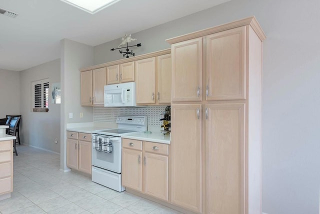 kitchen featuring backsplash, light brown cabinets, and white appliances