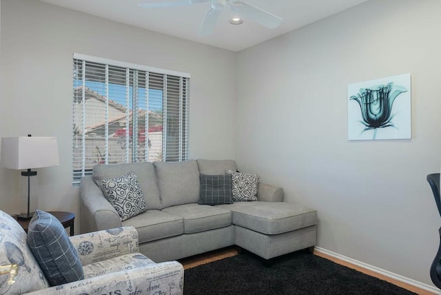 living room with ceiling fan and hardwood / wood-style floors