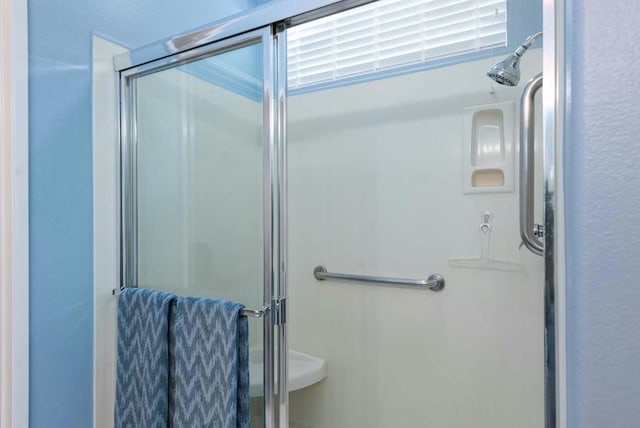 bathroom with an enclosed shower