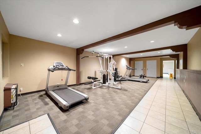 exercise room with light colored carpet