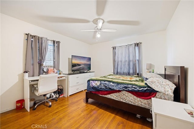 bedroom with light wood-type flooring and ceiling fan