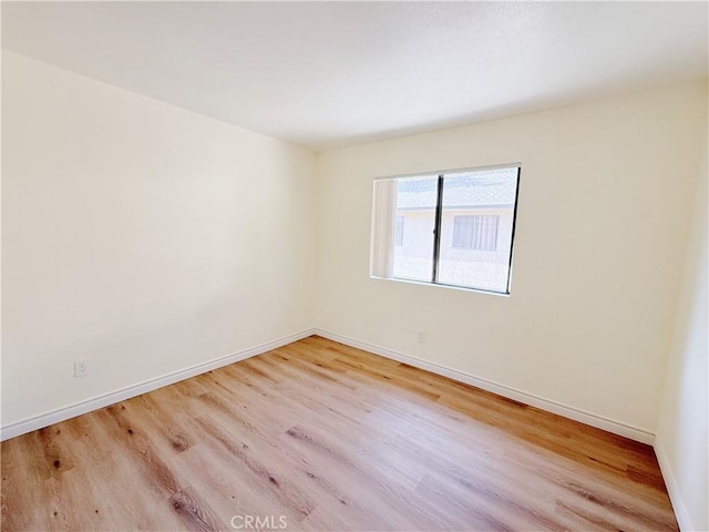 unfurnished room with light hardwood / wood-style floors